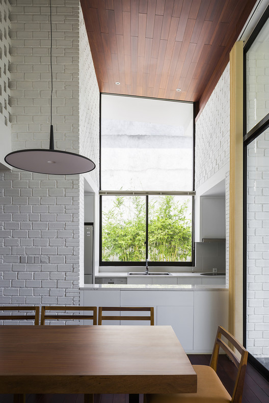 A House in Nha Trang / VTN Architects + ICADA - Table, Windows, Countertop, Chair, Beam