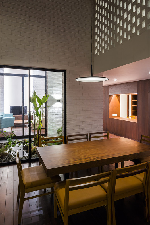 A House in Nha Trang / VTN Architects + ICADA - Table, Windows, Chair