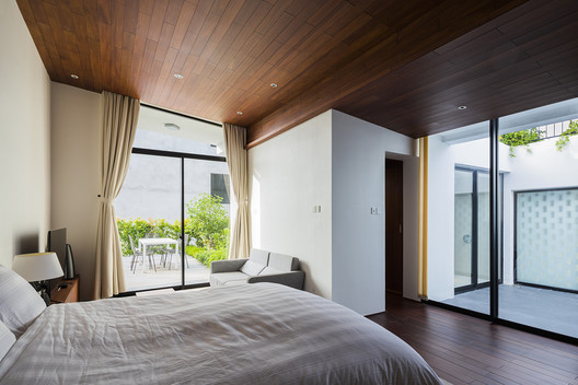 A House in Nha Trang / VTN Architects + ICADA - Bed, Windows, Bedroom, Chair